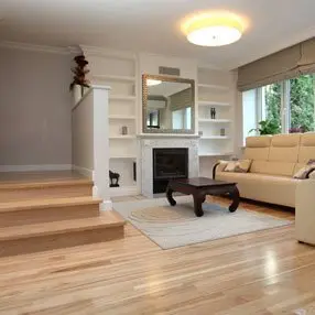 lower living room with wooden floor and corner sofa