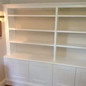 White shelving unit and cupboard