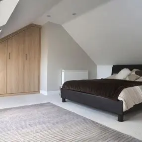 Attic conversion into bedroom with built in wardrobes